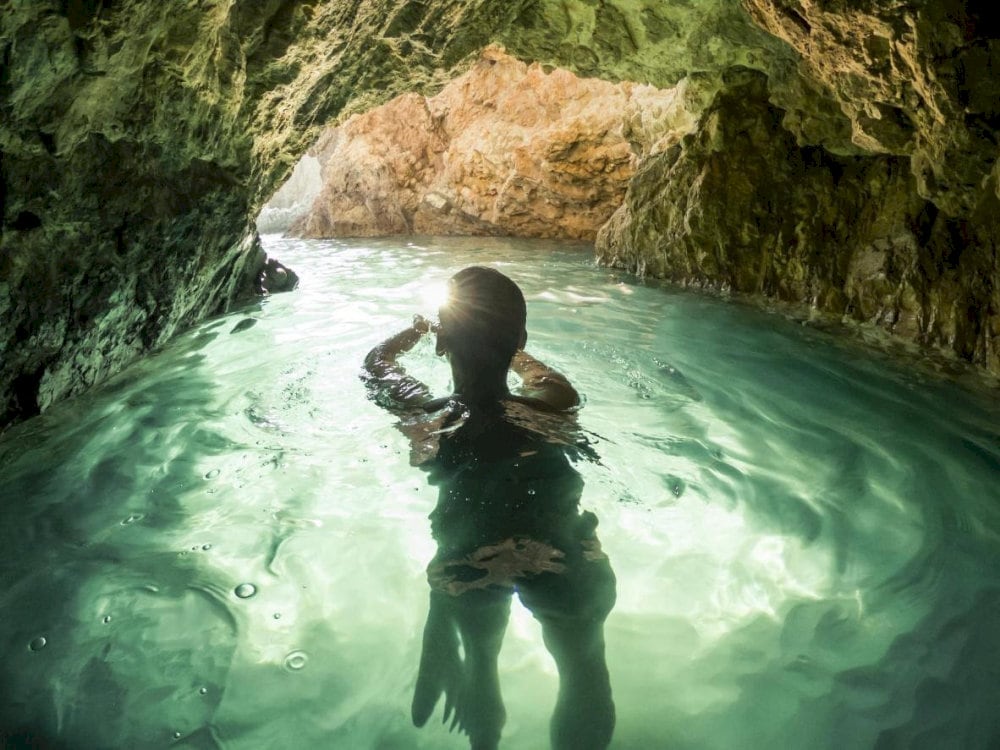 Adventurers begin their journey into the Dark Cave's depths
